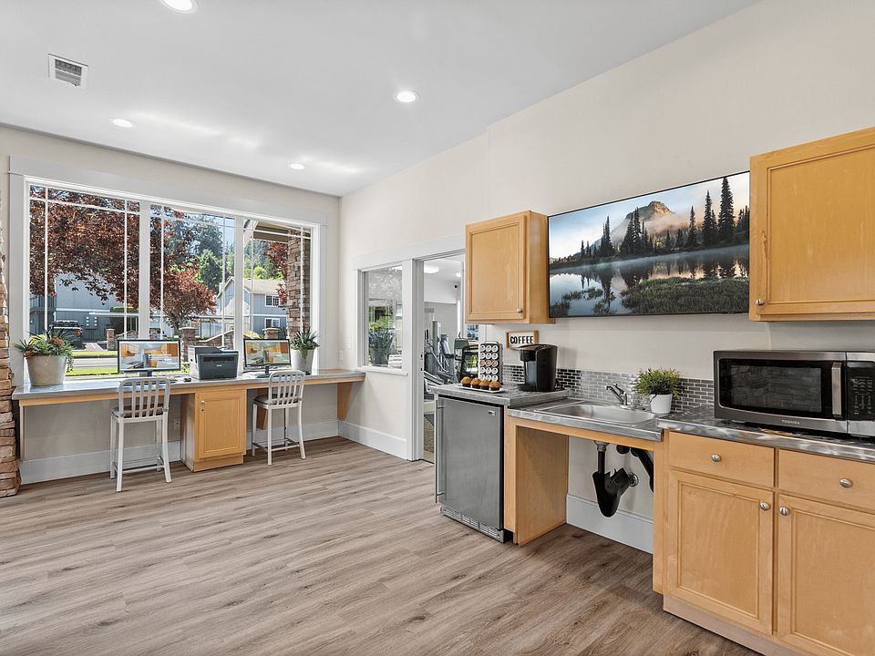 Clubhouse perks include a cozy coffee bar and business center.