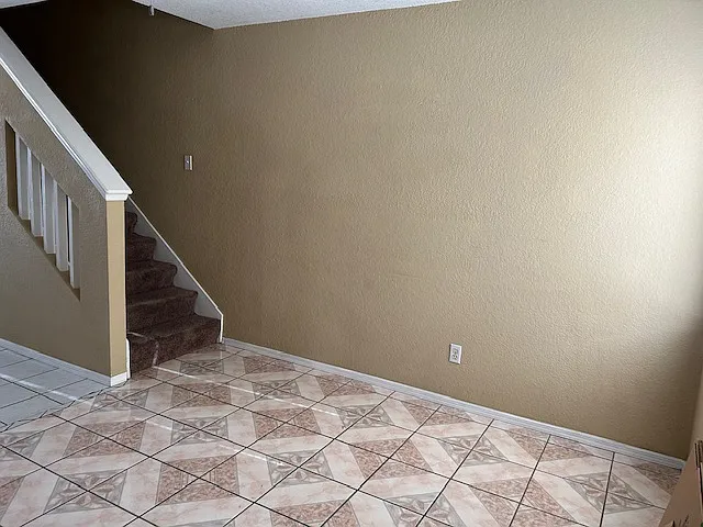 Part of living room and stairway to Master bedroom