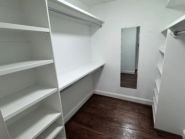 Primary closet with large shelves.