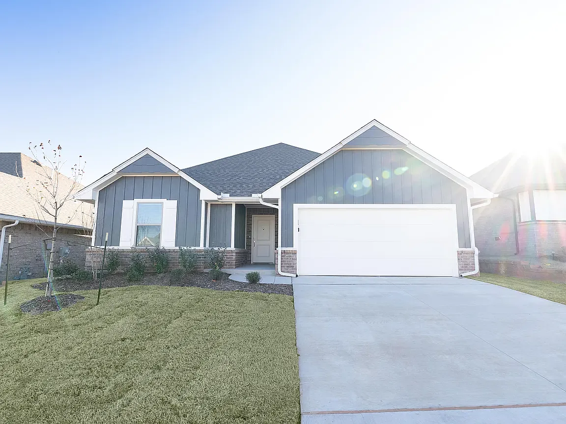 Front view, covered porch, double car garage, and beautiful landscaping - 10320 SW 55th Ter