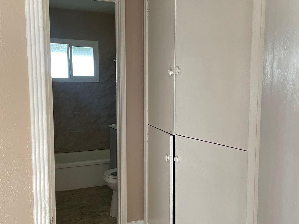 Hallway with linen closet.