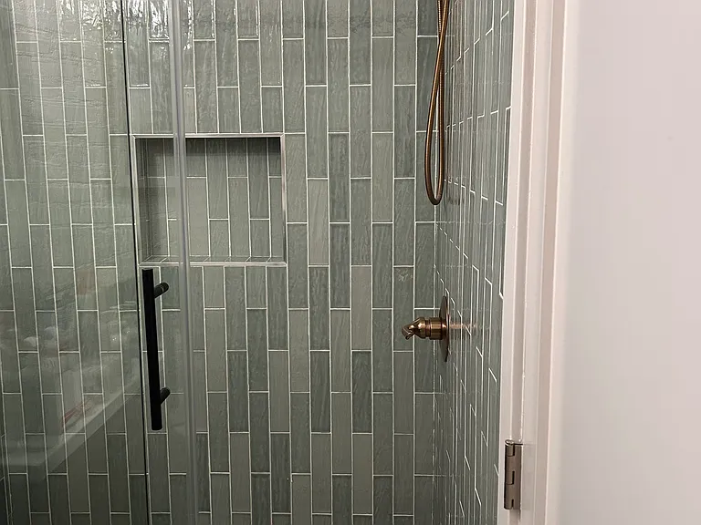 Main floor bathroom. Beautiful, newly renovated shower with new fixtures.