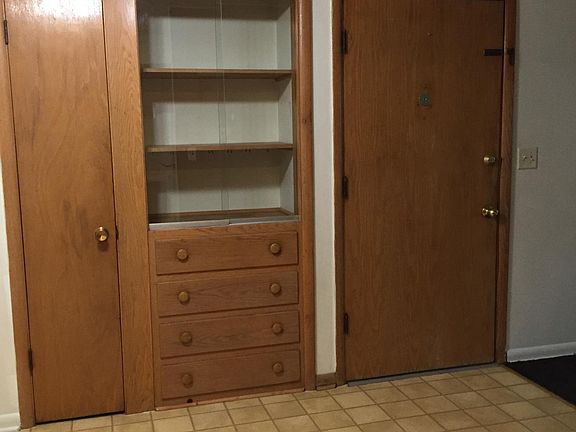 Entry door, China cabinet, broom closet
