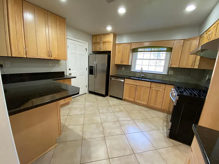 Kitchen with all stainless steel appliances.