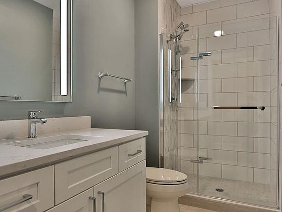 Luxury bathroom with premium tiled shower and floor