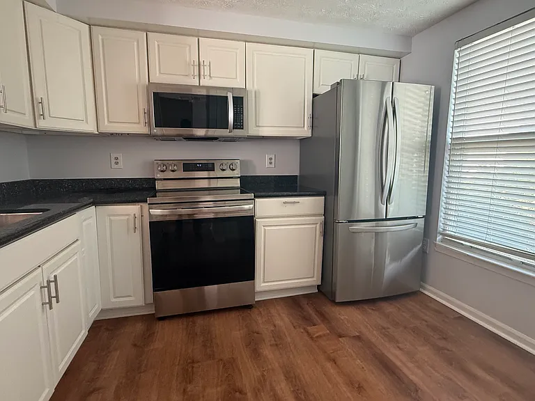 Kitchen with granite counter tops and stainless steel appliances