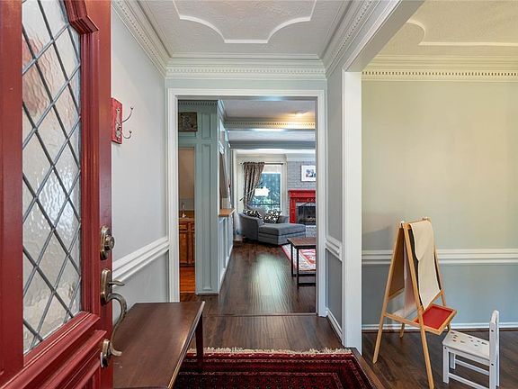 Wood-look plank flooring graces the interior entry and most of the home, with tile in the wet areas. NO carpet!