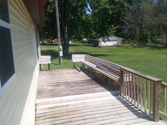Extra large deck overlooking the neighbor's pond. A great view of wild life and woods.
