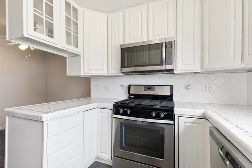 Chefs kitchen with newer stainless appliances(range, microwave, dishwasher, refrigerator) and views overlooking Los Angeles - 1265 Van Horne Ln