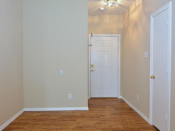 A view of the entry. To the left is a great area for a desk area.