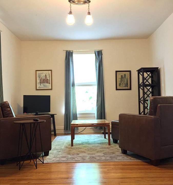 Living Room comes with two chairs, TV, coffee table, desk