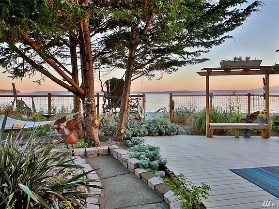 Step outside the yellow door, this is your view, your playground for beach living.  Note the big chair, much like a life guard's perch. Climb up and watch the skies turn various shades of orange as the sun sets.