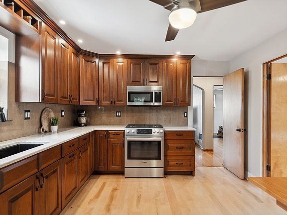The beautiful kitchen also features 5" wide plank