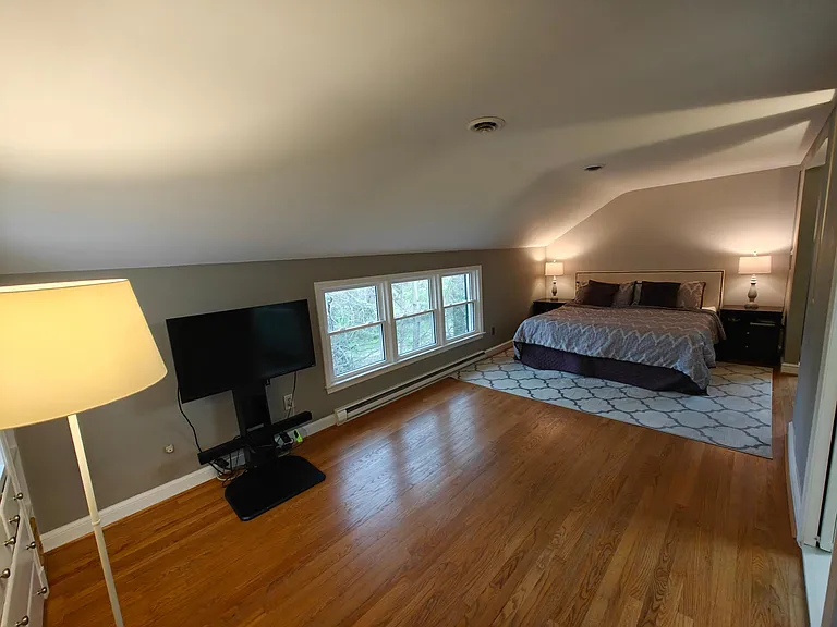 Master bedroom with King size bed for scale.