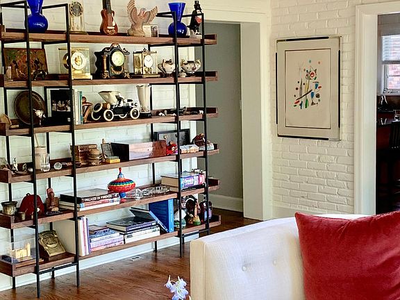 Shelves in sunroom for personal items