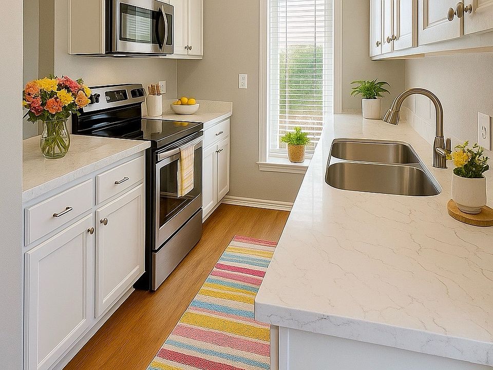 Upgraded Kitchen _ Stainless steel or black appliances, ample counter space, and modern cabinetry.