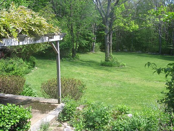 Patio with Wysteria Laden Pergola