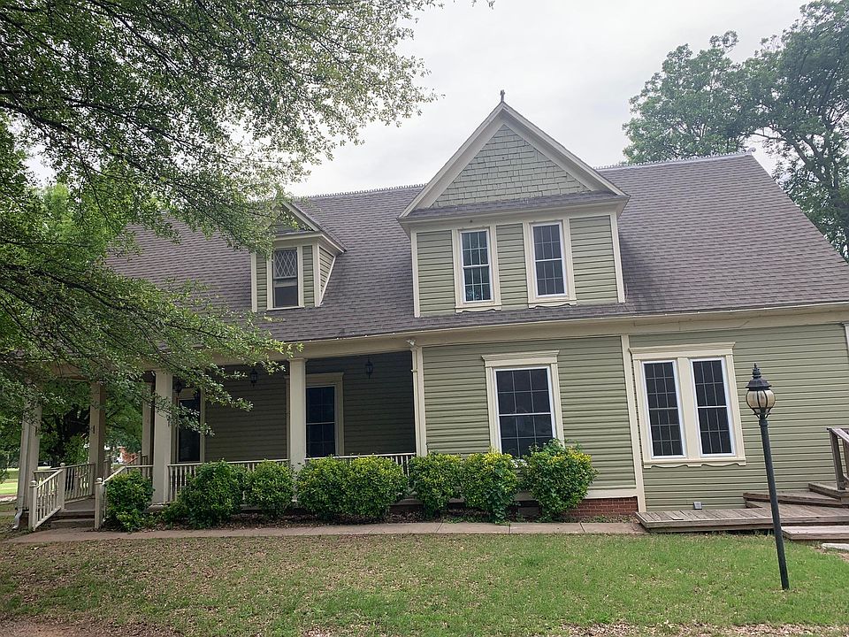 East side of the house with the beautiful porch.