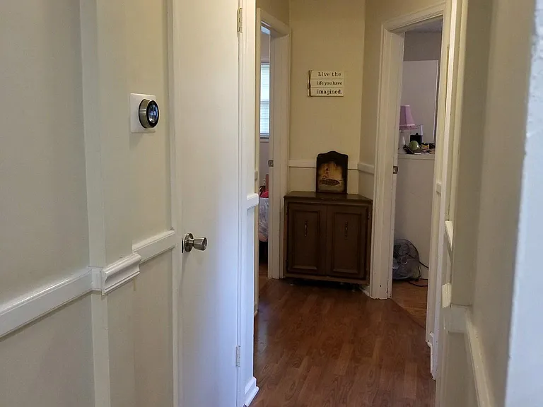 Hallway off kitchen to the 3 bedrooms and bathroom