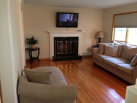 Living Room with Sparkling Hardwoods, Gas Fireplace & Bay Window!