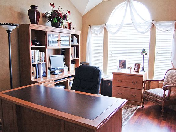 Multi-use dining/living currently serves as home office