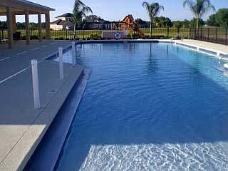 Clubhouse, large pool, and playground