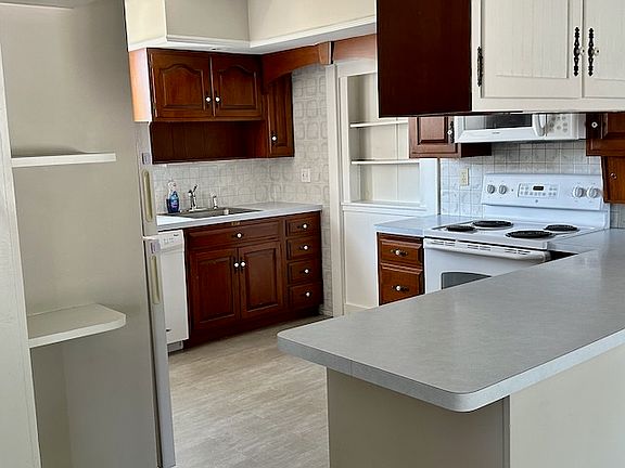 Full kitchen, easy clean vinyl floor, lots of storage, sunny and bright.
