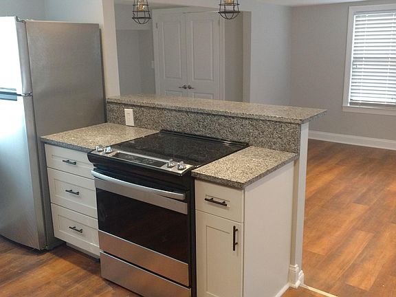 Fridge & Stove open to Living room