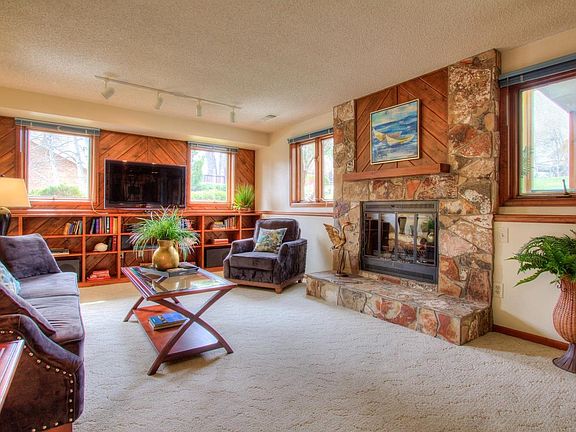 Custom built-ins and large wood burning stone F/P