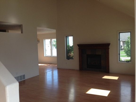 Light-filled living room with gas fireplace
