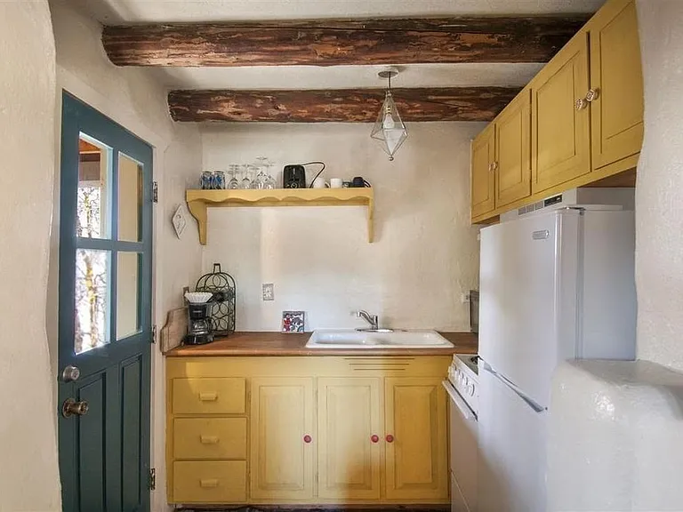 Kitchen w/ direct access to/from carport.