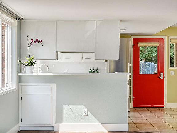 Kitchen bar with cupboard storage access.