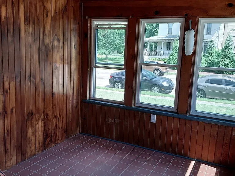 Enclosed patio with storage closet.