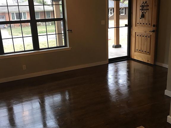 Large living room with refinished original wood floors