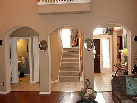 Entry opens into living room with wood floors