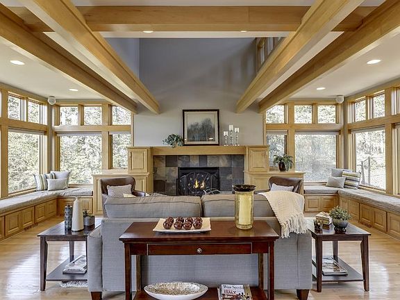 The living rooms shines with tons of natural light! Beautiful hardwood floors, gas fireplace with stone surround, high ceilings and natural woodwork.