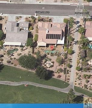 Over 1/3 acre golf course lot w/ pool, spa, raised gazebo, BBQ, covered South facing patio, mature fruit trees, SynLawn grass, fire pit & new Pebble Tec patio. The "A" marks the view of the back of the house. Tee boxes are shown in lower part of the picture.