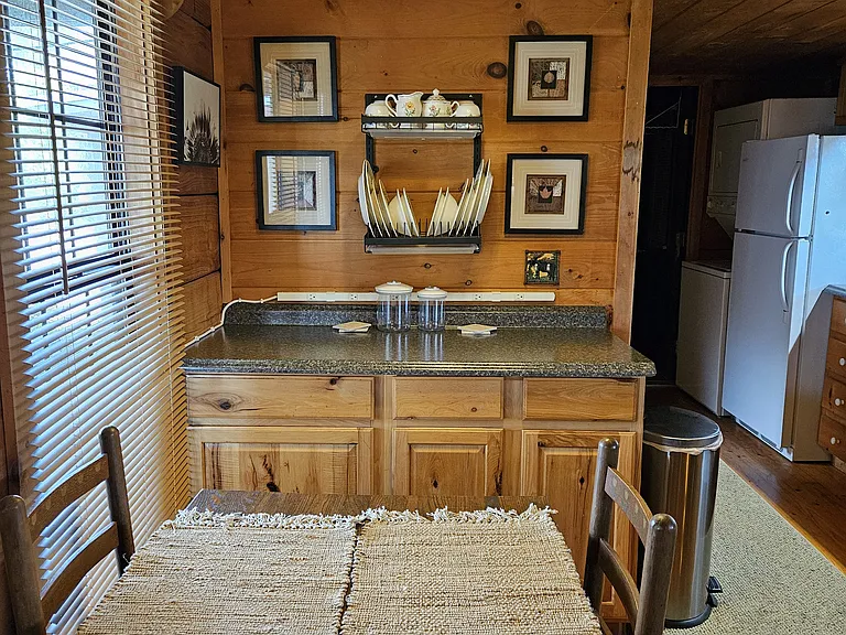 Eat in area with cabinets, electrical, and drawer and cabinet storage underneath