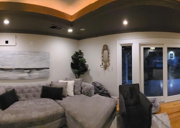 360 view of the living room with the kitchen on the left.