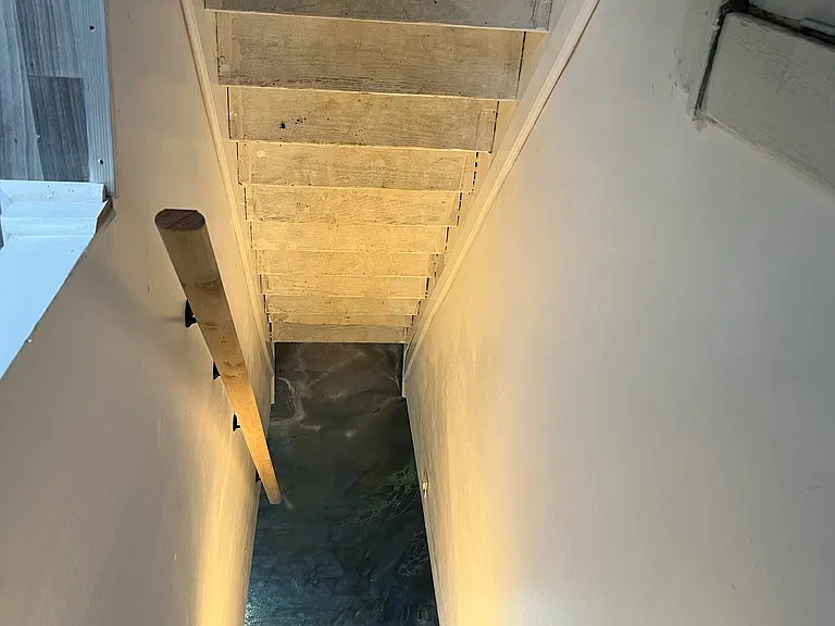 Stairs to dinning room & kitchen access to upper level of home