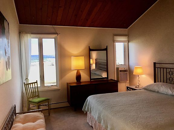 Master bedroom with king bed and views