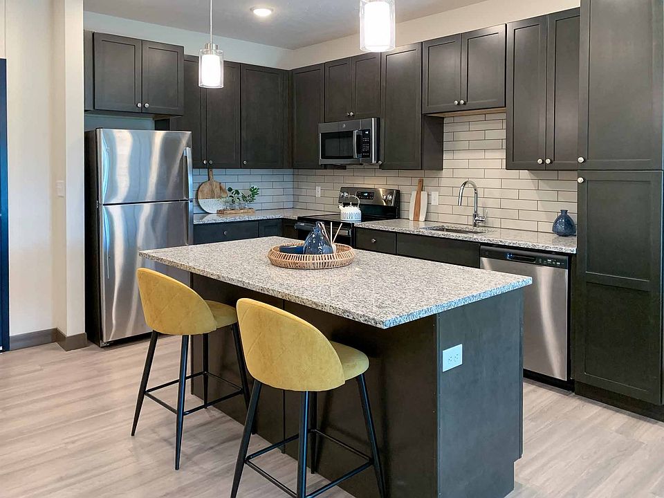Our kitchens feature spacious layouts and modern stainless steel appliances.