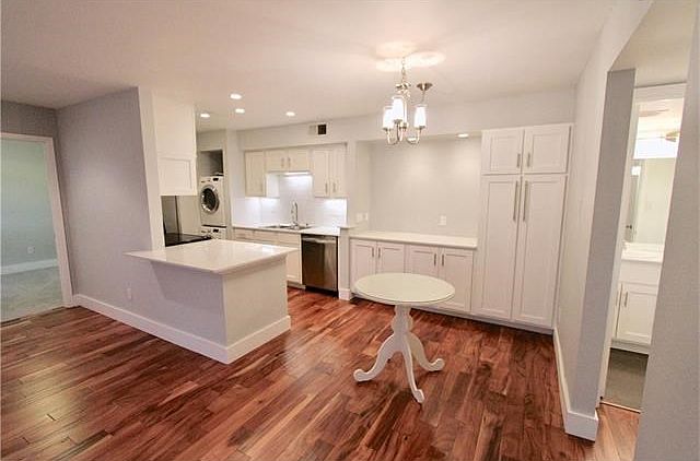 Everything is new! Acacia floors, custom cabinets, quartz counters, stainless appliances, pull-out pantry storage, recessed and under cabinet lighting, etc.