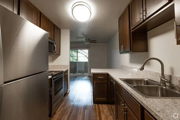 Remodeled kitchens with stainless steels appliances.