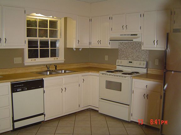 Kitchen with pantry and attached screened porch!