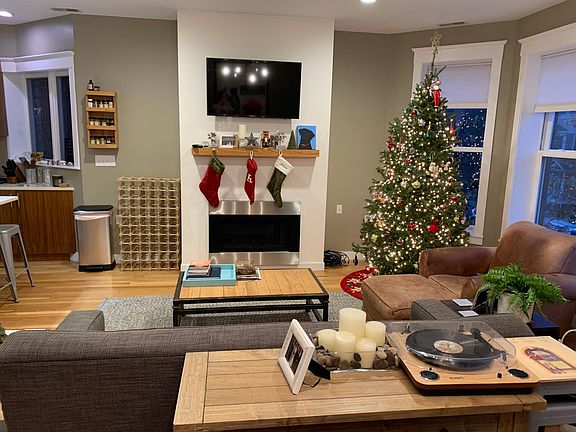 Living area in open plan with fireplace.