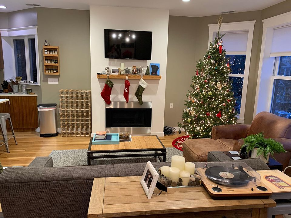 Living area in open plan with fireplace.