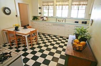 kitchen with a Wedgewood gas oven, dishwasher, linoleum floor and ceramic tile