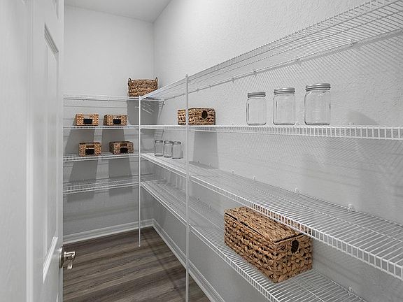 You will find built-in convenience throughout, such as this walk-in pantry - Summerlyn II by Highlan
