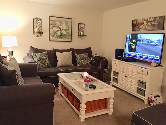 Living room with air conditioner.